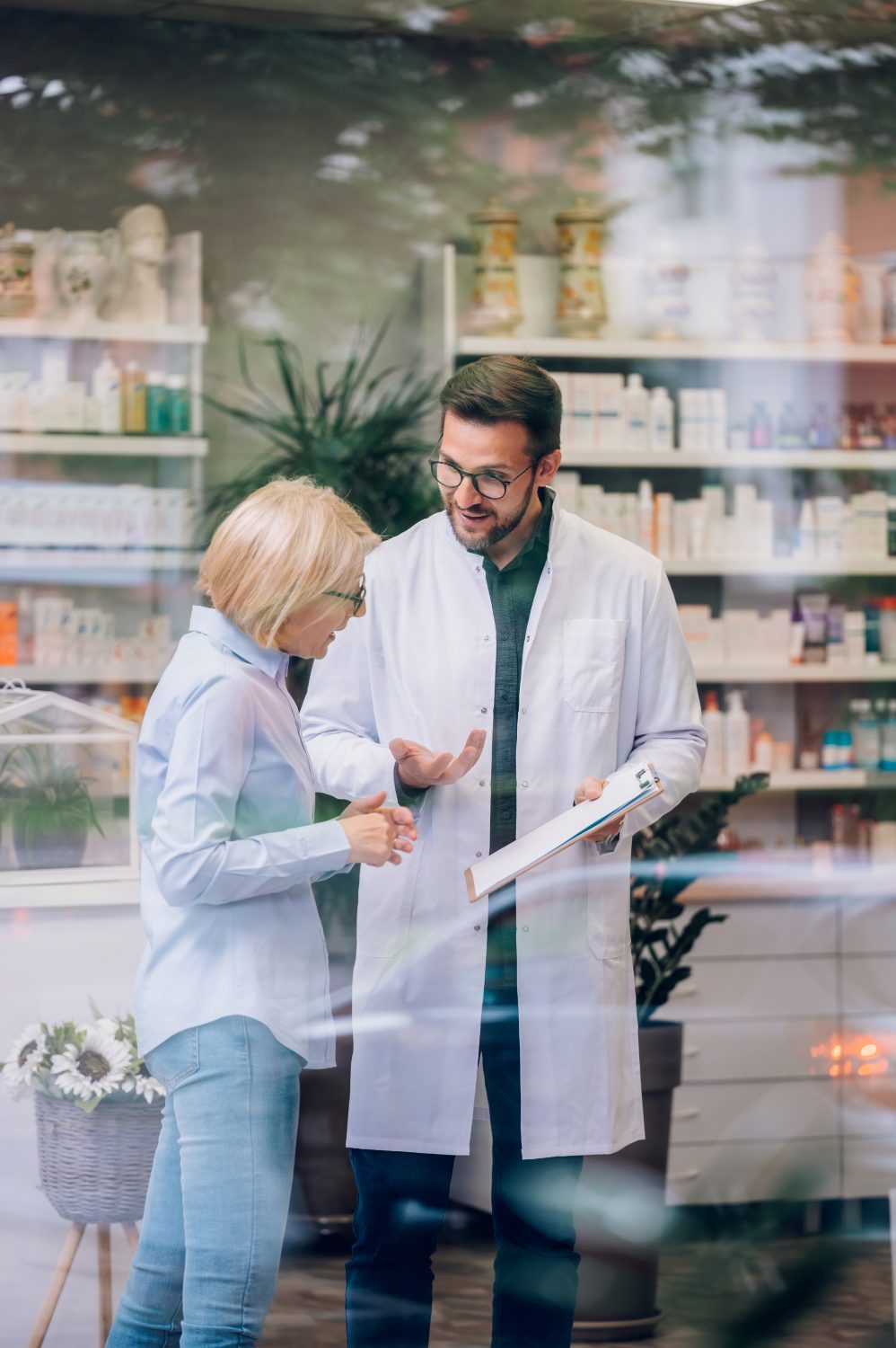 Pharmacist consulting at the pharmacy window
